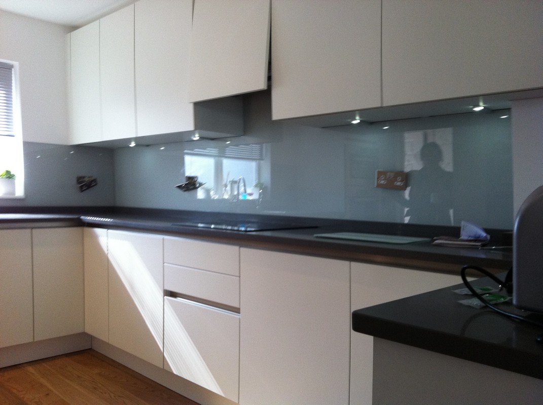 Grey glass kitchen splashback with LED lighting in Plaistow
