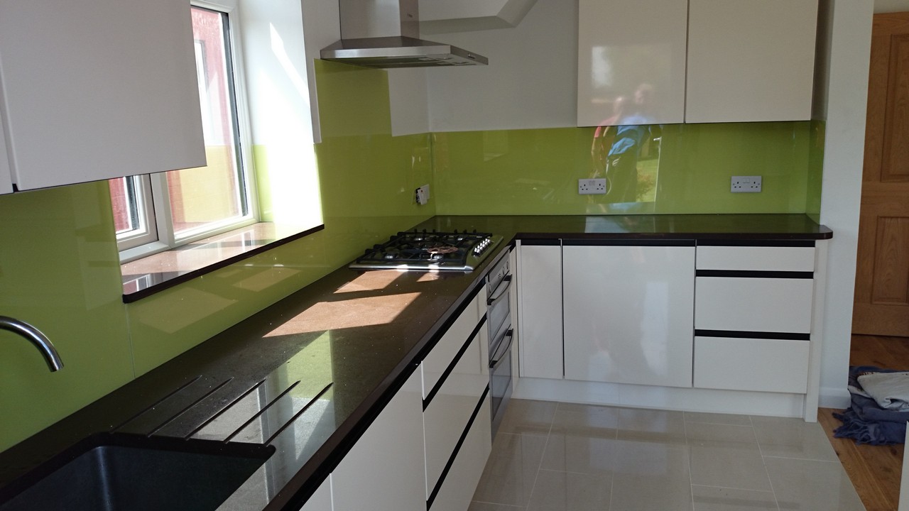 Lime green glass kitchen splashback installed by Plaistow glaziers