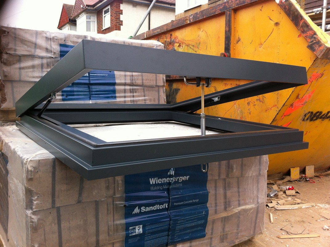 Opening flat roof skylight in anthracite grey installed in Plaistow