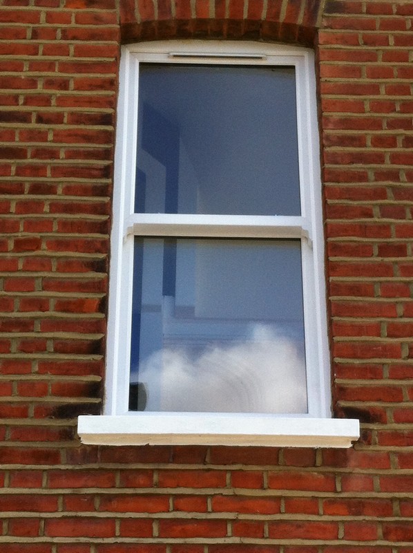 uPVC sash window on Victorian red brick house in Plaistow